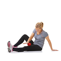Image showing Woman, massage ball and healing for health in studio, injury and wellness by white background. Female person, athlete and physical therapy or rehabilitation for muscles in legs and body in mockup