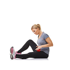 Image showing Woman, massage ball and healing in studio, injury and health or wellness by white background. Female person, athlete and physical therapy or rehabilitation for muscles in legs and body in mockup