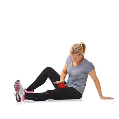 Image showing Woman, massage ball and healing body or rehabilitation, injury and health or wellness by white background. Female person, athlete and physical therapy in studio for muscles in legs and body in mockup