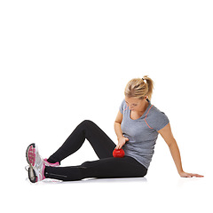 Image showing Woman, massage ball and fitness in studio, healing injury and health or wellness by white background. Female person, athlete and physical therapy or rehabilitation for muscles in body and mockup