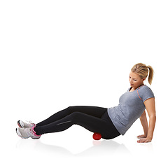 Image showing Woman, massage ball and fitness in studio, injury and health or wellness by white background. Female person, athlete and physical therapy or rehabilitation for muscles in legs and body in mockup