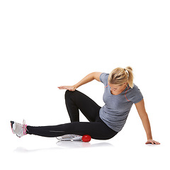 Image showing Massage ball, woman pain and leg physio for fitness, workout and sport training injury in studio. Health, stretching and exercise equipment with person bruise and wellness with white background
