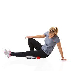 Image showing Woman, massage ball and physical therapy in studio, injury and health or wellness by white background. Female person, athlete and healing or rehabilitation for muscles in legs and body in mockup