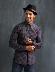 Image showing Fashion, happy and man on gray background with confidence in trendy style, clothes and casual outfit. Smile, handsome and face of person on texture wall with accessory, pride and positive attitude