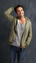 Image showing Fashion, confidence and portrait of man on gray background with trendy style, clothes and casual outfit. Happy, handsome and face of person on texture wall with smile, pride and positive attitude