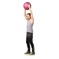 Image showing Man, medicine ball and gym workout in studio for training exercise, balance goal or white background. Male person, sports equipment and muscle fitness or mockup space for healthy, cardio or strong