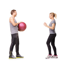 Image showing Coaching, man and woman with gym ball for fitness in studio, body wellness and support. Sports workout, fit girl and personal trainer with sphere for balance, training and power on white background.