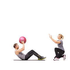 Image showing Training, man and woman with gym ball for fitness in studio, body wellness and support. Sports workout space, girl and personal trainer with sphere for balance, coaching and power on white background