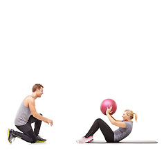 Image showing Coaching, man and woman with gym ball for fitness in studio, body wellness and support. Sports workout, fit girl and personal trainer with sphere for balance, training and power on white background.