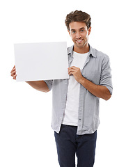 Image showing Portrait, advertising and man on poster, smile and mockup space isolated on a white studio background. Happy person show paper banner, sales promotion and blank placard presentation, sign and info