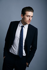 Image showing Portrait, fashion and man with business, employee and confident guy on a grey studio background. Person, corporate and model with suit, elegant outfit and stylish clothes with professional and worker