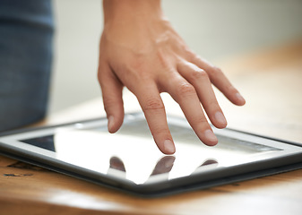 Image showing Hand, person and tablet on desk, email communication and work, touchscreen or online. Information technology, internet or wireless for connection, digital or office worker in workplace, touch or web