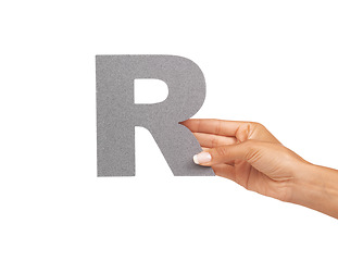 Image showing Woman, hand and letter R or alphabet in studio for advertising, learning and teaching presentation. Sign, font and character for abc, text or communication and grammar or symbol on white background