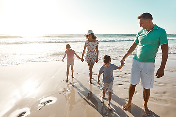 Image showing Parents, children and beach or holding hands for happy summer or travel, ocean sunshine or sibling development. Man, woman and kids on sand for holiday relax walking or outdoor, clean air or vacation