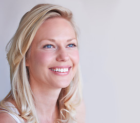 Image showing Thinking, happy and a young woman with smile for idea, vision and memory with mockup space. Face, female person and excitement emoji for future, contemplating or planning on a white background