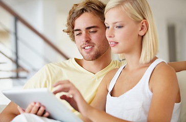 Image showing Smile, tablet and young couple on sofa browsing on social media or internet at apartment. Happy, digital technology and man and woman from Australia relax and scroll on website in living room at home