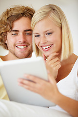 Image showing Smile, tablet and young couple on sofa browsing on social media or internet at apartment. Happy, digital technology and man and woman from Australia relax and scroll on website in living room at home