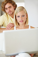 Image showing Serious, laptop and young couple on sofa browsing on social media or the internet at apartment. Relax, technology and man and woman doing research on website with computer in living room at home.