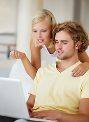 Image showing Laptop, search and couple on a sofa with social media, movies or streaming at home together. Online shopping, internet and people in a living room checking ecommerce website deal for December sale