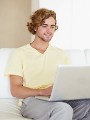 Image showing Laptop, remote work and happy man on sofa for research, planning or web communication in his home. Tech, freelance and male entrepreneur online in living room with social media, search or streaming