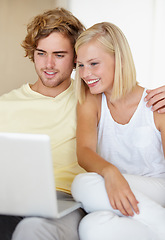 Image showing Laptop, love and happy couple relax in a house streaming movies, video or film, show or social media together. Tech, search and people in living room with online entertainment for weekend or vacation
