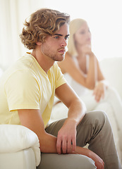 Image showing Angry couple, fight and divorce stress on a sofa with argument, anxiety or cheating depression in their home. Marriage crisis, dispute and overthinking man ignore frustrated woman in a living room