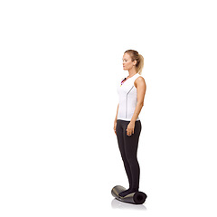 Image showing Woman, balance and mat in studio for fitness, pilates or workout for healthy body, wellness or exercise. Person, face and yoga in sportswear for physical activity on mock up space or white background