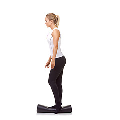 Image showing Woman, exercise and mat in studio for balance, pilates or workout for healthy body, wellness or fitness. Person, face and yoga in sportswear for physical activity on mock up space or white background