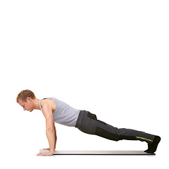 Image showing Man, workout and mat in studio for push ups, fitness or exercise for healthy body, wellness or core muscle. Person, balance and training on floor or abdomen health on mockup space or white background