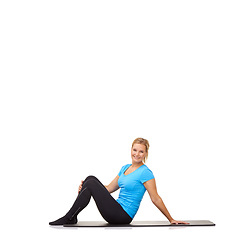 Image showing Woman, yoga and portrait on floor of studio for exercise, healthy workout and smile isolated on white background. Wellness, training and happy lady on mat for fitness, strong body and mockup space