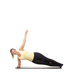 Image showing Woman, yoga and mat in studio for stretching, fitness or workout for healthy body, smile and core muscle. Person, portrait and pilates on floor for abdomen health on mockup space or white background