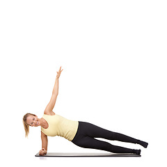 Image showing Woman, pilates and mat in studio for stretching, fitness or workout for healthy body, happy or core muscle. Person, portrait or yoga on floor for abdomen health on mockup space or white background