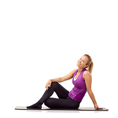 Image showing Woman, fitness and happy portrait on floor in studio for yoga, performance and healthy body isolated on white background. Wellness, workout and strong lady smile on mat for exercise, power and mockup