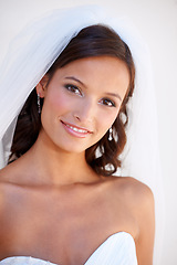 Image showing Portrait, smile and a bride at her wedding for love, marriage or an event of tradition in celebration of commitment. Face, beauty and elegance with a happy young woman getting married at a ceremony
