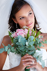 Image showing Bride woman, bouquet and flowers at wedding with thinking, pride and commitment at event, celebration and party. Girl, marriage and floral plants for love, roses or vision with smile, ideas or memory