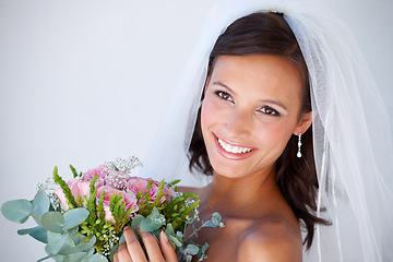 Image showing Smile, wedding and young woman with flowers for luxury marriage ceremony, party or reception. Happy, love and beautiful bride from Mexico with makeup and floral bouquet for romantic celebration.