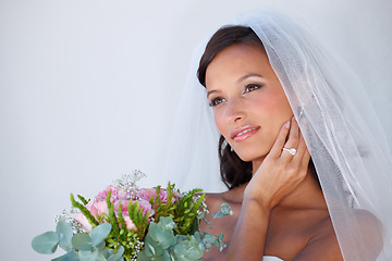 Image showing Thinking, wedding and young woman with flowers, veil and engagement ring for marriage ceremony. Smile, beauty and bride with makeup face and floral bouquet for elegant, romantic and love reception.