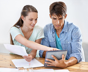 Image showing Office, woman and man with tablet, paperwork and help brainstorming for online research. Startup, partnership and business people at desk with digital app for collaboration, coworking and documents.