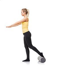 Image showing Studio, foam roller and woman training for leg strength challenge, balance or rehabilitation fitness. Pilates, mockup space or girl workout for body wellness, recovery or activity on white background