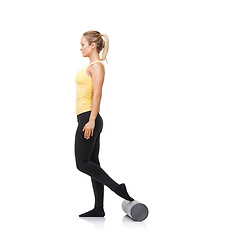 Image showing Woman, foam and roller for exercise, balance and fitness workout in studio on white background. Pilates, profile and healthy lady with foot on rolling tube for training, wellness and physiotherapy