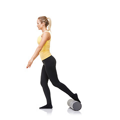 Image showing Studio, foam roller and woman workout legs for strength challenge, gym club performance or quad muscle rehabilitation. Pilates exercise, mockup space and female athlete training on white background