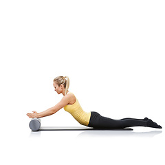 Image showing Health, foam roller and woman in a studio for exercise, stretching or gym routine with yoga mat. Stability, balance and young female athlete from Australia with body workout by white background.