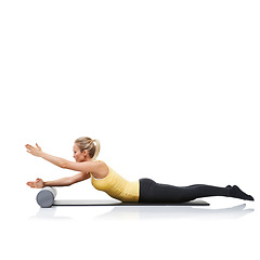 Image showing Pilates, foam roller and woman in floor exercise, stretching or gym routine for sports wellness, fitness or physical training. Stability, mockup studio space or profile of athlete on white background