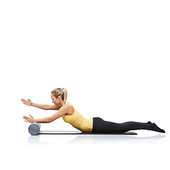 Image showing Pilates, foam roller and woman in floor workout, stretching or gym routine for wellness, fitness or physical training. Activity, mockup studio space and profile of female athlete on white background