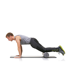 Image showing Exercise, foam roller and man in floor push up for arm strength building, muscle growth or bodybuilding workout. Balance, mockup studio space or sports person in pilates training on white background