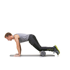 Image showing Arm exercise, foam roller and man in push up for strength training, muscle endurance or pilates rehabilitation workout on ground. Yoga mat, mockup studio space or active person on white background