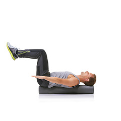 Image showing Balance workout, foam roller and man in pilates back exercise, stability and endurance performance for core strength. Fitness, mockup studio space and sports athlete on white background floor