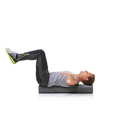 Image showing Balance exercise, foam roller and man in pilates workout, stability and endurance performance. Floor, mockup studio space and athlete fitness for core muscle strength development on white background