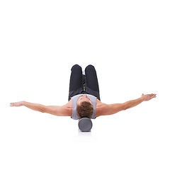 Image showing Balance, foam roller and person in pilates training, floor stability or muscle endurance activity for spine rehabilitation. Studio, mockup space and athlete core strength exercise on white background