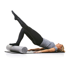 Image showing Legs exercise, foam roller and studio woman with bridge workout, balance activity or wellness for gym pilates on floor. Fitness, body training and athlete core muscle development on white background